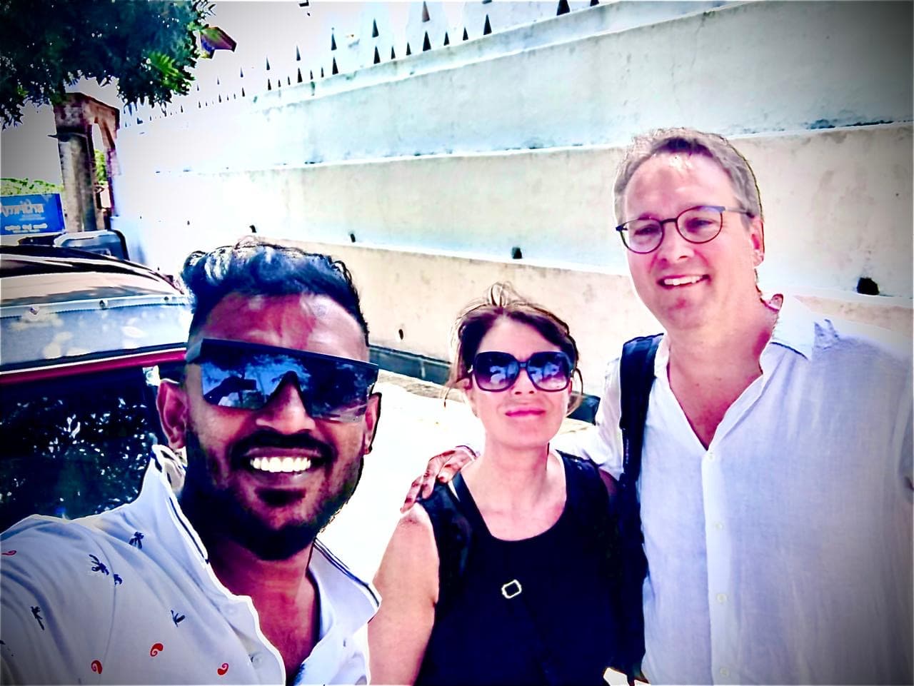 Couple with tuk tuk driver near Temple of the Tooth Relic Kandy
