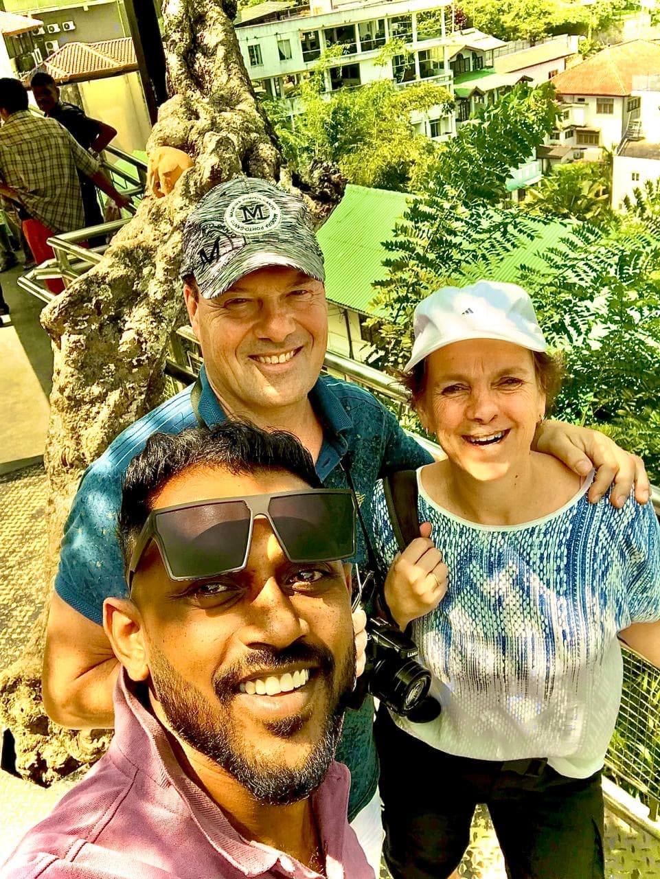 Tourists at Kandy viewpoint overlooking the city - tuk tuk sightseeing Kandy