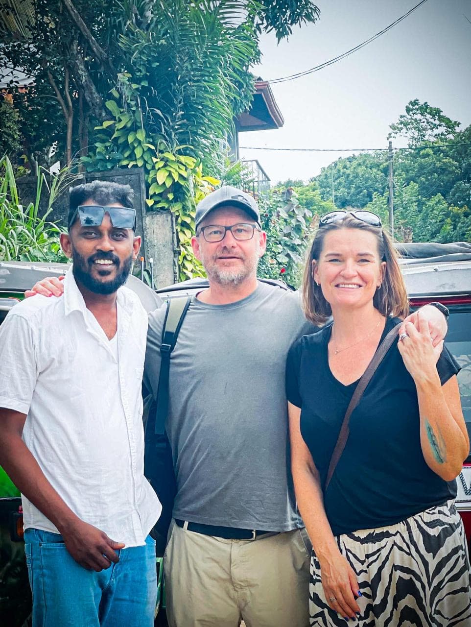 Happy couple with tuk tuk driver Roshel after Kandy city tour
