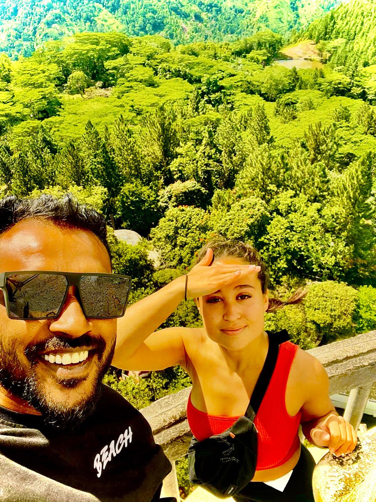 Tourist enjoying lush green mountain scenery near Nuwara Eliya on tuk tuk tour